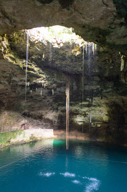 istock Dark cenote (water reservoir) underground in Yucatan, Mexico. Popular touristic attraction 823534444