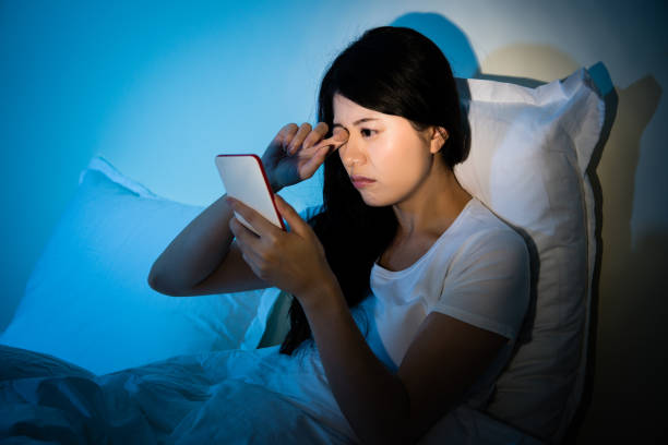 istock Woman rubbing eyes with using smartphone 823538372