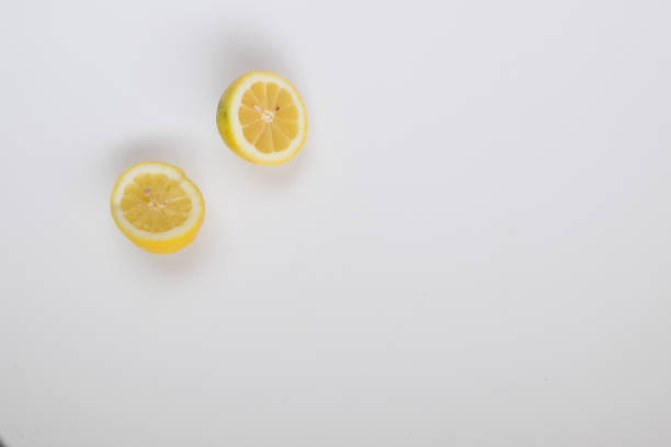 Halved Lemons on a White Background stock photo