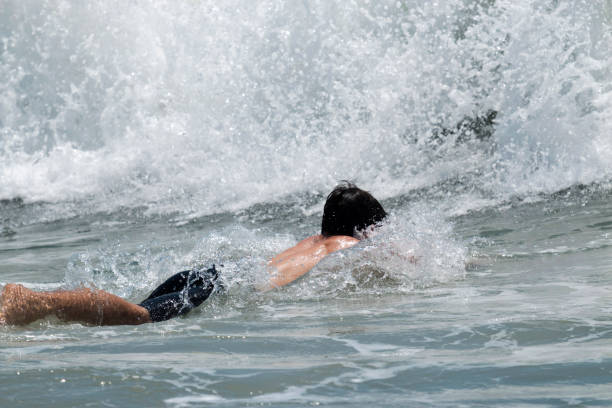 istock Diving into a wave in the Atlantic Ocean 823540986