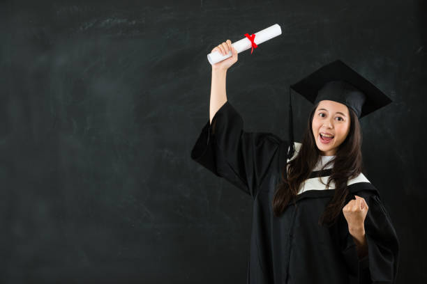 istock gesture asian woman holding graduation scroll 823541220
