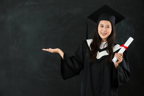 istock woman getting diploma open the hand 823541262