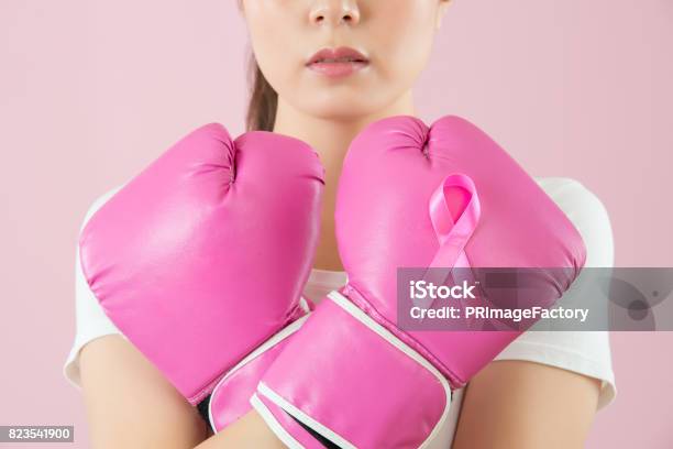 Chinese Girl Wear Boxing Gloves Crossed Arms Stock Photo - Download Image Now - Breast Cancer, Cancer - Illness, Fighting