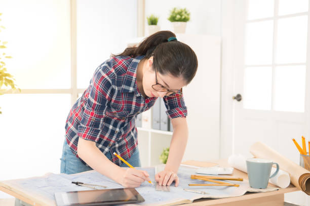 istock pretty asian architect woman using rule 823547016
