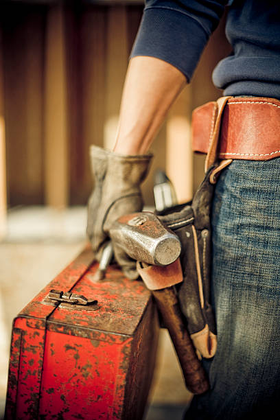 Man standing on construction site with tools  construction worker photos stock pictures, royalty-free photos & images