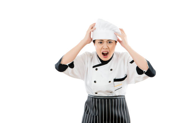 istock woman chef shocked and grab her head 823553546