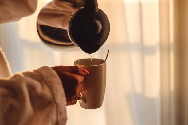 istock Woman making her coffee in the morning 823559036