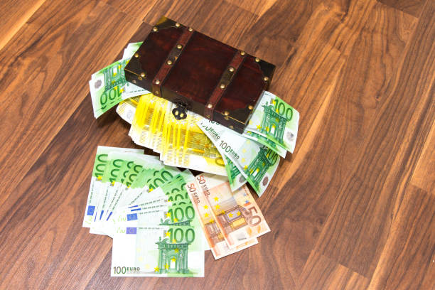 istock Bills in the wooden chest 823564976