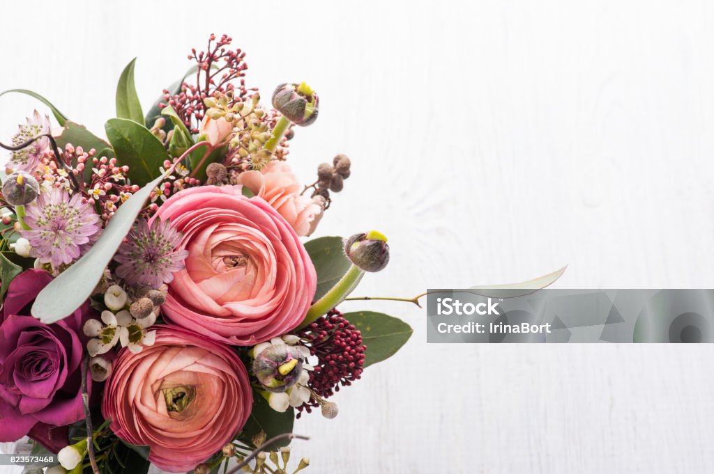 Bouquet of flowers in tin mug on light background Beautiful bouquet of flowers in tin mug on light background. Closeup, floral composition Bouquet Stock Photo
