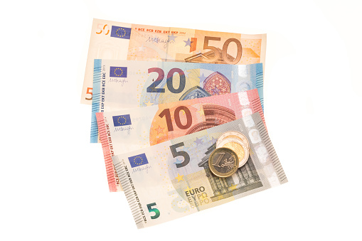 European Euro currency banknotes and one Euro coins - white background