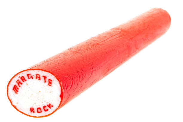 Stick of rock from Margate, UK A stick of sweet Margate rock candy. It is a British tradition that every seaside town has a stick of rock with the name of the town passing through it, eg Brighton, Bournemouth, Margate etc. isle of thanet photos stock pictures, royalty-free photos & images