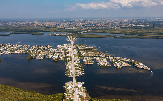An aerial view of the historic Florida town Matlacha and bridge connecting by bridge with Pine Island with Cape Coral. Florida