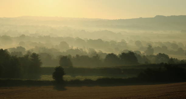 istock Sunrise on a misty morning over Axe Valley 823595002