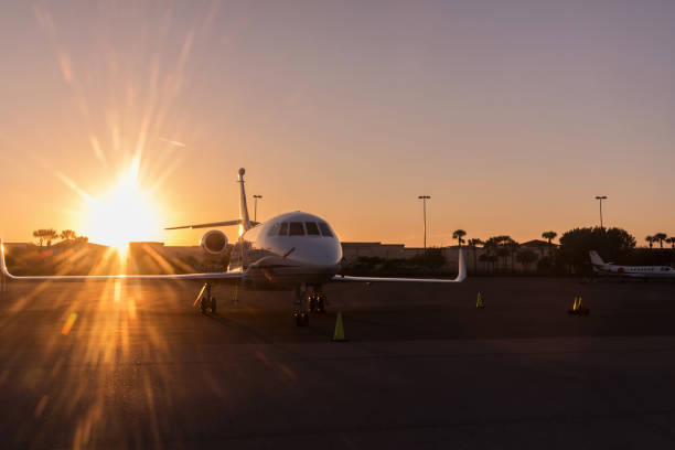 istock Modern Jet parked on runway in sunny day, amazing sunset. 823600258