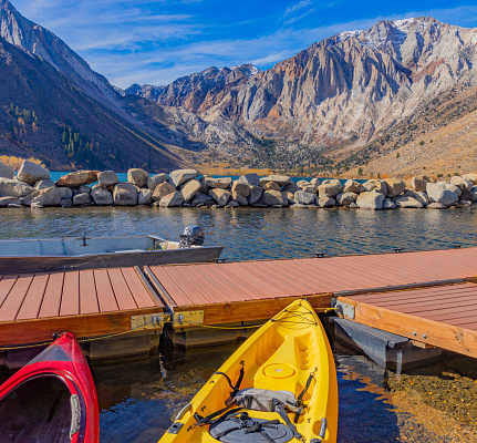 Convict Lake ,fall aspen trees, ,Sierra Nevada Mountains, two  Kayaks, boat dock, red kayak, yellow kayak