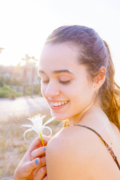 istock Young woman posing in the beach sunrise 823603534