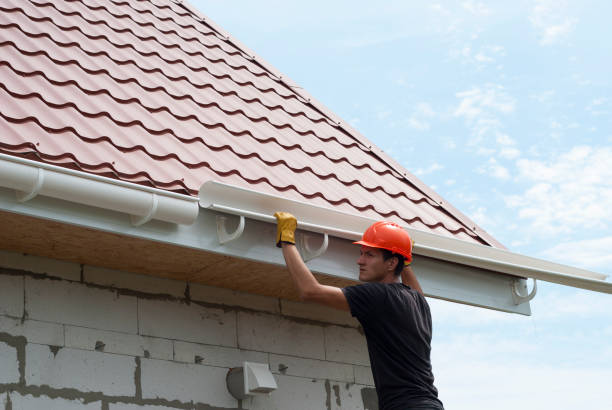 gutter system worker installs the gutter system on the roof roof gutter photos stock pictures, royalty-free photos & images