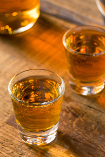 istock Alcoholic Brown Rum in a Shot Glass 823607020