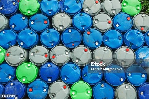 Blue Grey And Green Oil Barrels On A Pile Chemical Plant Plastic Storage Drums Stock Photo - Download Image Now