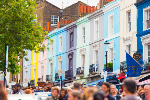 London, UK – May 13, 2017: Portobello Road, Notting Hill, London, UK is a very famous place for tourists in London. Portobello Road is a street in the Notting Hill district of the Royal Borough of Kensington and Chelsea in west London. On Saturdays it is home to Portobello Road Market, one of London's notable street markets, known for its second-hand clothes and antiques.