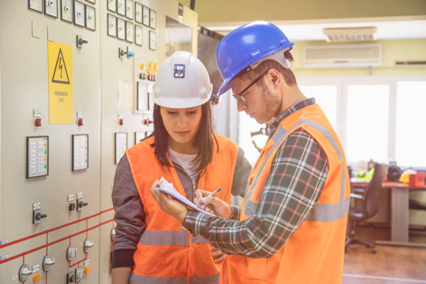 istock Professional industrial engineers operating in electricity substation 823616370