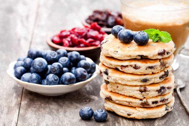 stack  of welsh cakes with blueberry and a cup of coffee - chocolate white chocolate chocolate chip white imagens e fotografias de stock