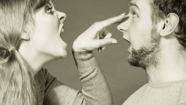 istock Aggressive woman yelling on man. 823620032