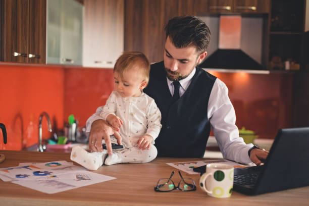 istock Young father working with his baby boy 823622816