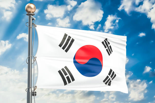 istock South Korea flag waving in blue cloudy sky, 3D rendering 823627180