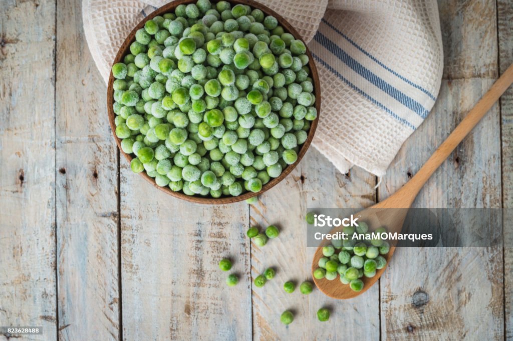 Fresh frozen peas. Fresh frozen peas. Vegetable food background healthy vegetarian natural meal. Frozen Stock Photo