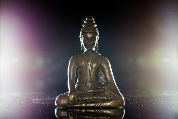 istock Enlightenment. Traditional buddha figurine in meditation pose. 823630774