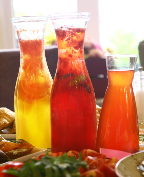 istock transparent glass jars with fruit drink 823630868