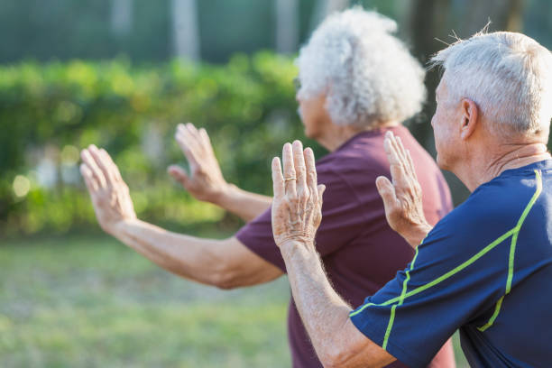 istock Side view of two senior men practicing tai chi 823634600