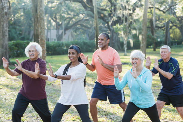 istock Multi-ethnic group of seniors taking tai chi class 823634604
