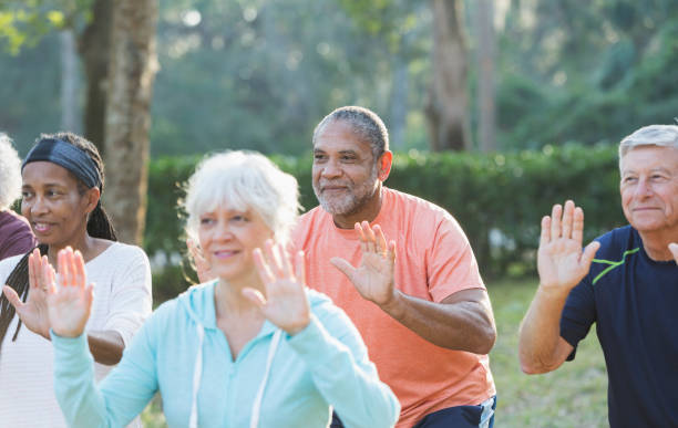 istock Multi-ethnic group of seniors taking tai chi class 823634628