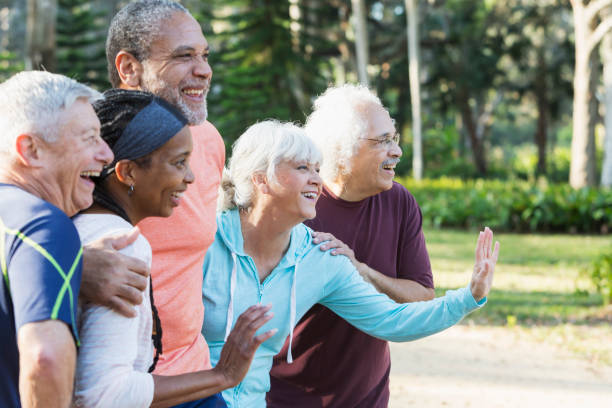 istock Group of five multi-ethnic seniors standing in park 823634688