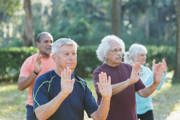 istock Multi-ethnic group of seniors taking tai chi class 823634706