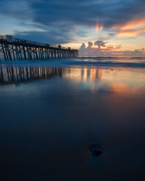 istock Reflection of sunrise on wet sand. 823634714