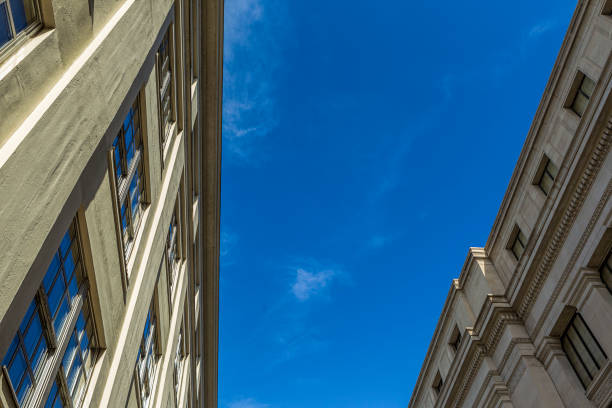 istock Looking up at buildings and sky. 823634754