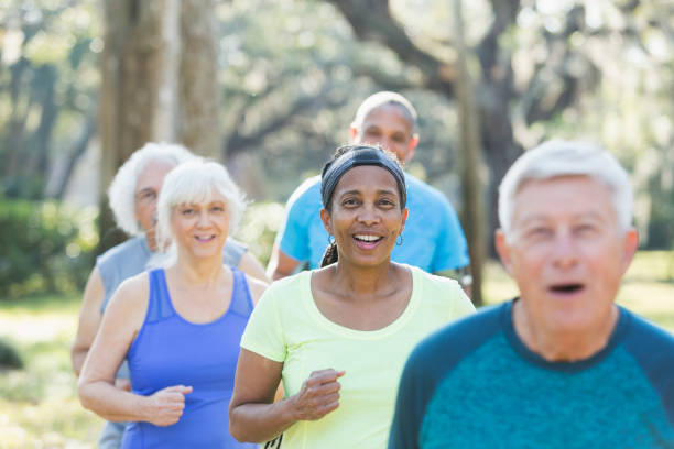 istock Multi-ethnic group of seniors running in park 823634828