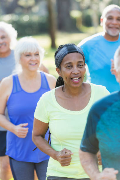 istock Multi-ethnic group of seniors running in park 823634830