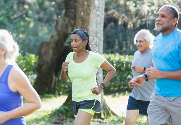 istock Multi-ethnic group of seniors running in park 823634954