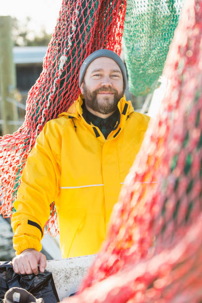 istock Man working on commercial fishing vessel 823634970