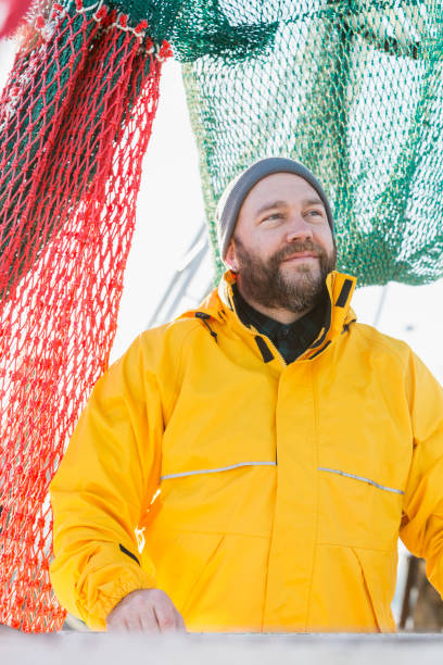 istock Man working on commercial fishing vessel 823635014