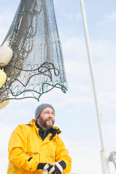 istock Man working on commercial shrimp boat 823637176