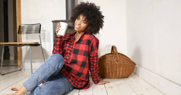 istock African american woman drinking coffee at home 823640984