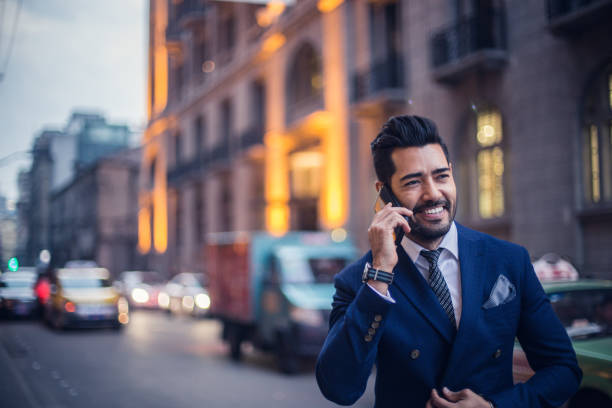 istock Businessman talking on the mobile phone outside 823650556