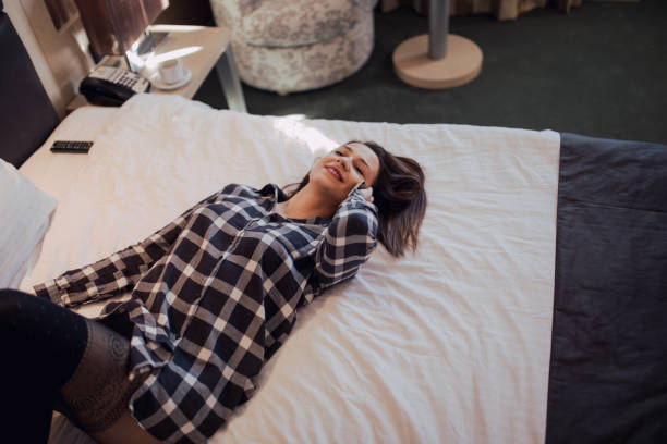 istock Woman lying on big bed 823650686
