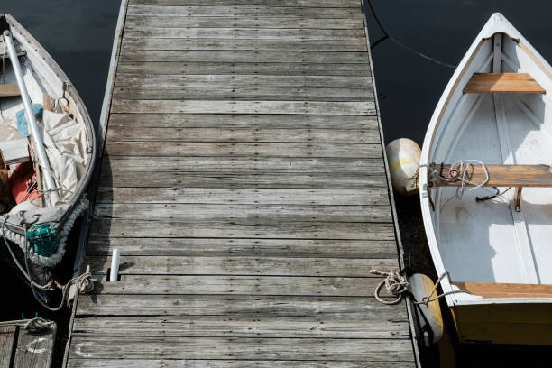 Colorful Skiffs sit along side a wooden dock in New England