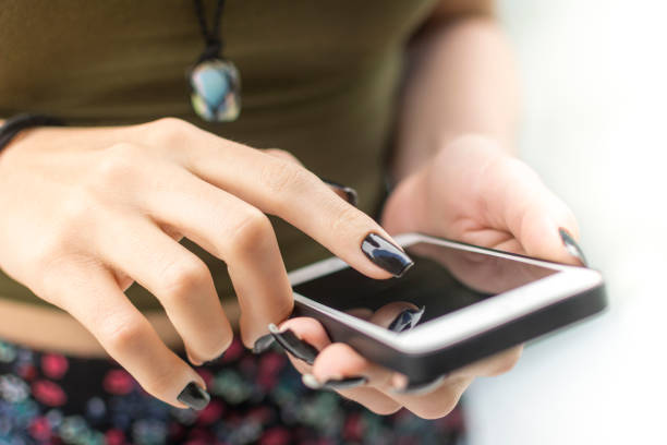 istock Woman hands touching smart phone 823658710